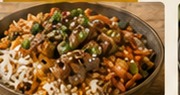 Fakeaway-style rice bowl with vegetables and sauce